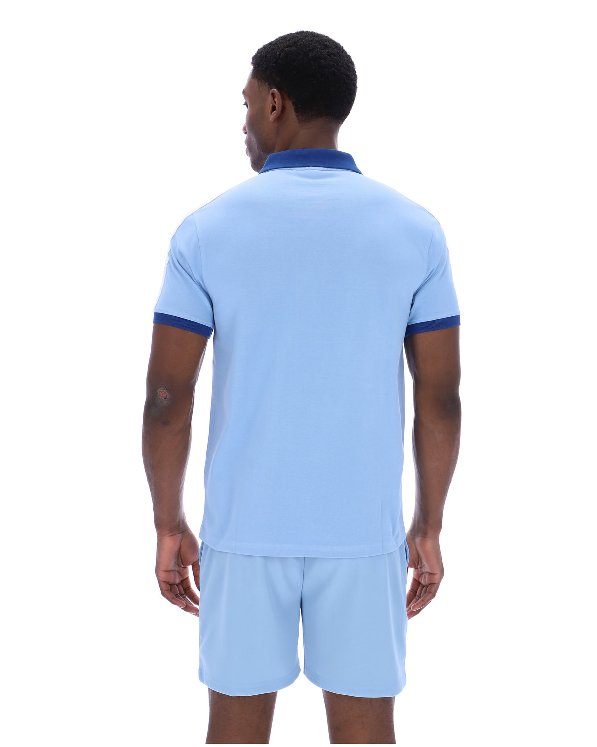 Displays a model wearing the Frozen Fjord 'FILA' branded Mattia Contrast Panel Polo Shirt