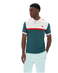 Man wearing a green and white polo shirt with a red stripe on a white background