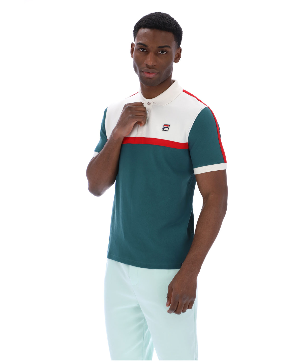 Man wearing a green and white polo shirt with a red stripe on a white background