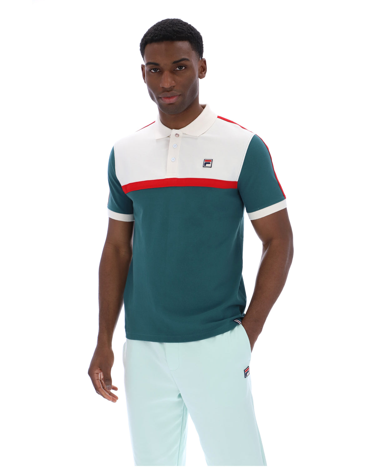 Man wearing a green and white polo shirt with a red stripe on a white background