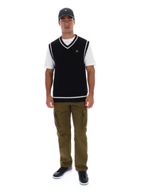 Displays a model wearing the Black 'FILA' branded Mellor Textured Knit Vest with Tipping