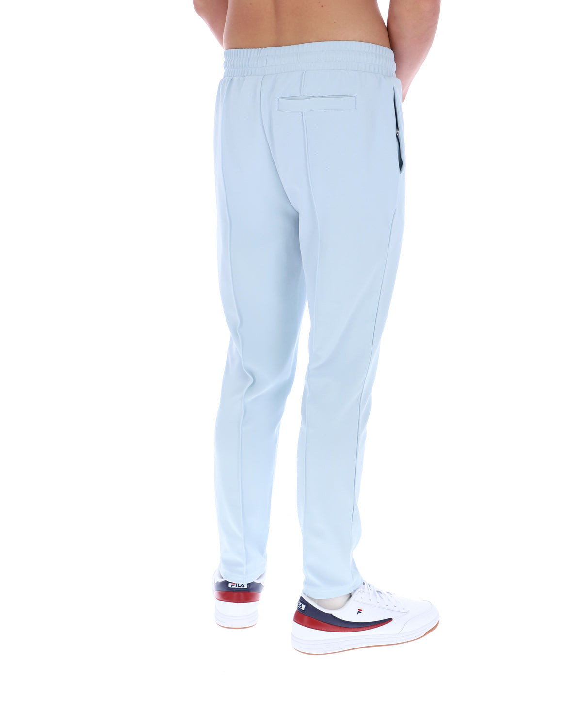 Light blue pants worn by a person on a white background