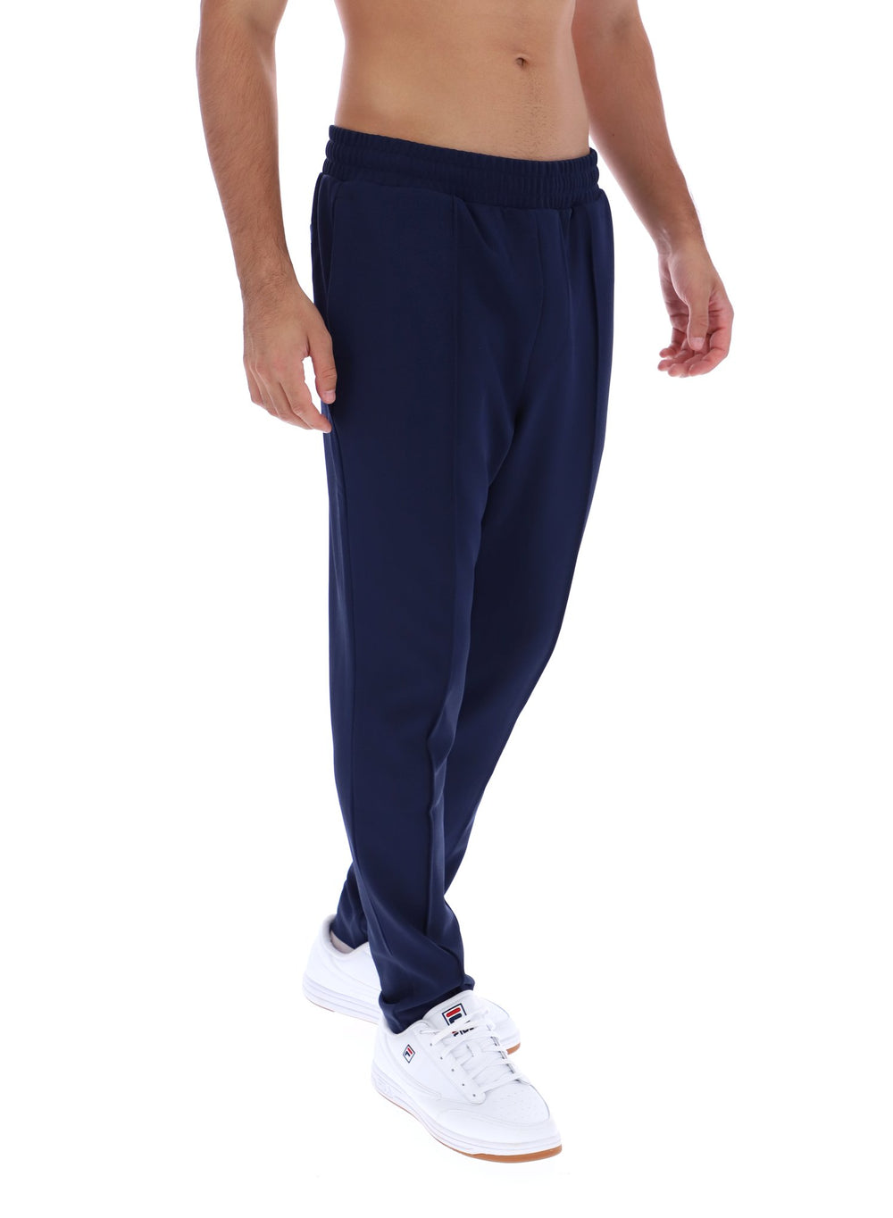 Navy blue pants worn by a person on a white background