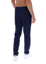 Navy blue pants worn by a person on a white background