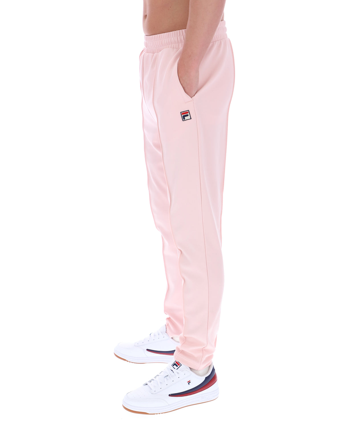 Pink sweatpants with a small logo on a white background