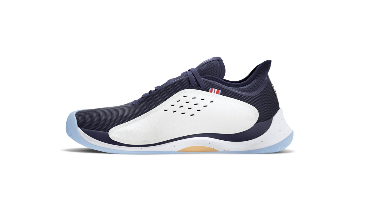 A pair of FILA Mondo Forza Tennis Trainers in white and navy colour scheme.