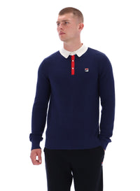Man wearing a navy long-sleeve polo shirt with a white collar and red accents on a white background
