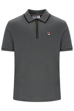 A dark gray short-sleeve polo shirt by Fila, featuring a half-zip collar with a black zipper, a black inner collar trim, and the signature Fila logo patch on the left chest.