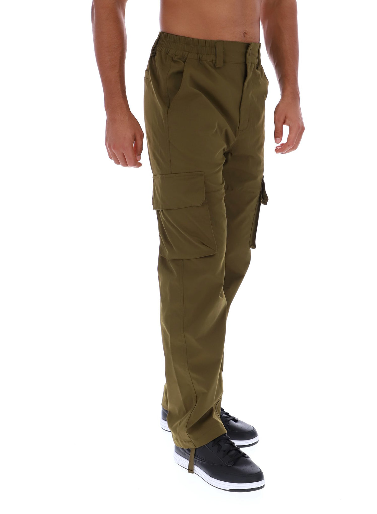 Displays a model wearing the Dark Olive 'FILA' branded Oscar Cargo Pants