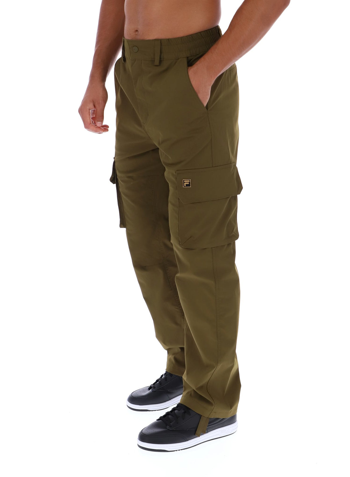 Displays a model wearing the Dark Olive 'FILA' branded Oscar Cargo Pants