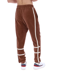 Brown velour track pants with white stripes on a white background
