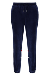 Navy blue jogger pants with small red and white patches on a white background