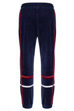 Navy tracksuit pants with red and white stripes on a white background