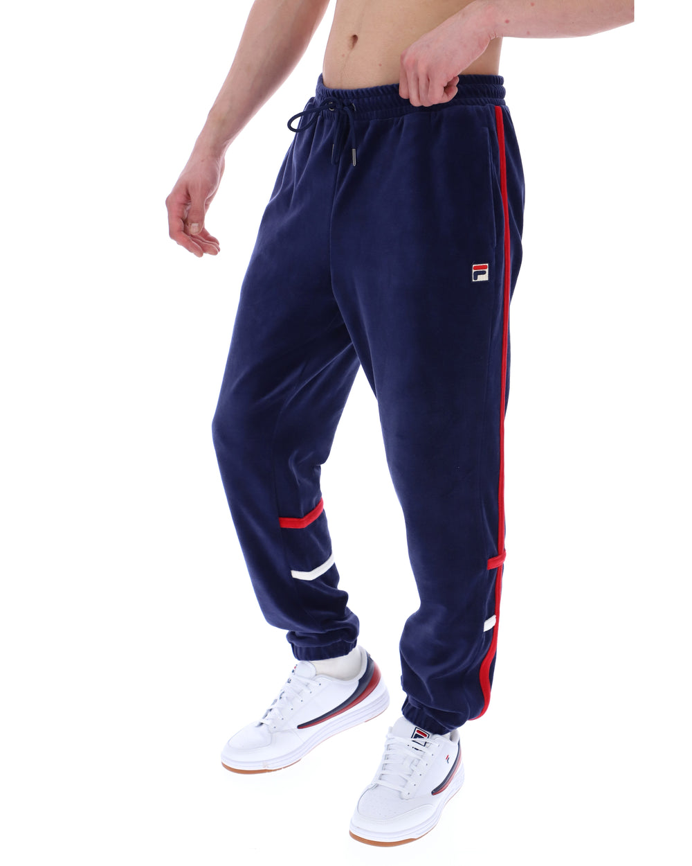 Navy tracksuit with red stripes worn by a person on a white background