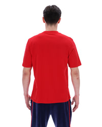 Person wearing a red shirt and navy shorts with red stripes on a white background