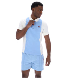 Displays a model wearing the Frozen 'Fila' branded Fjord Pierro Zip Up Polo