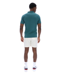 Displays a model wearing the Mediterranea 'FILA' branded Pierro Zip Up Polo