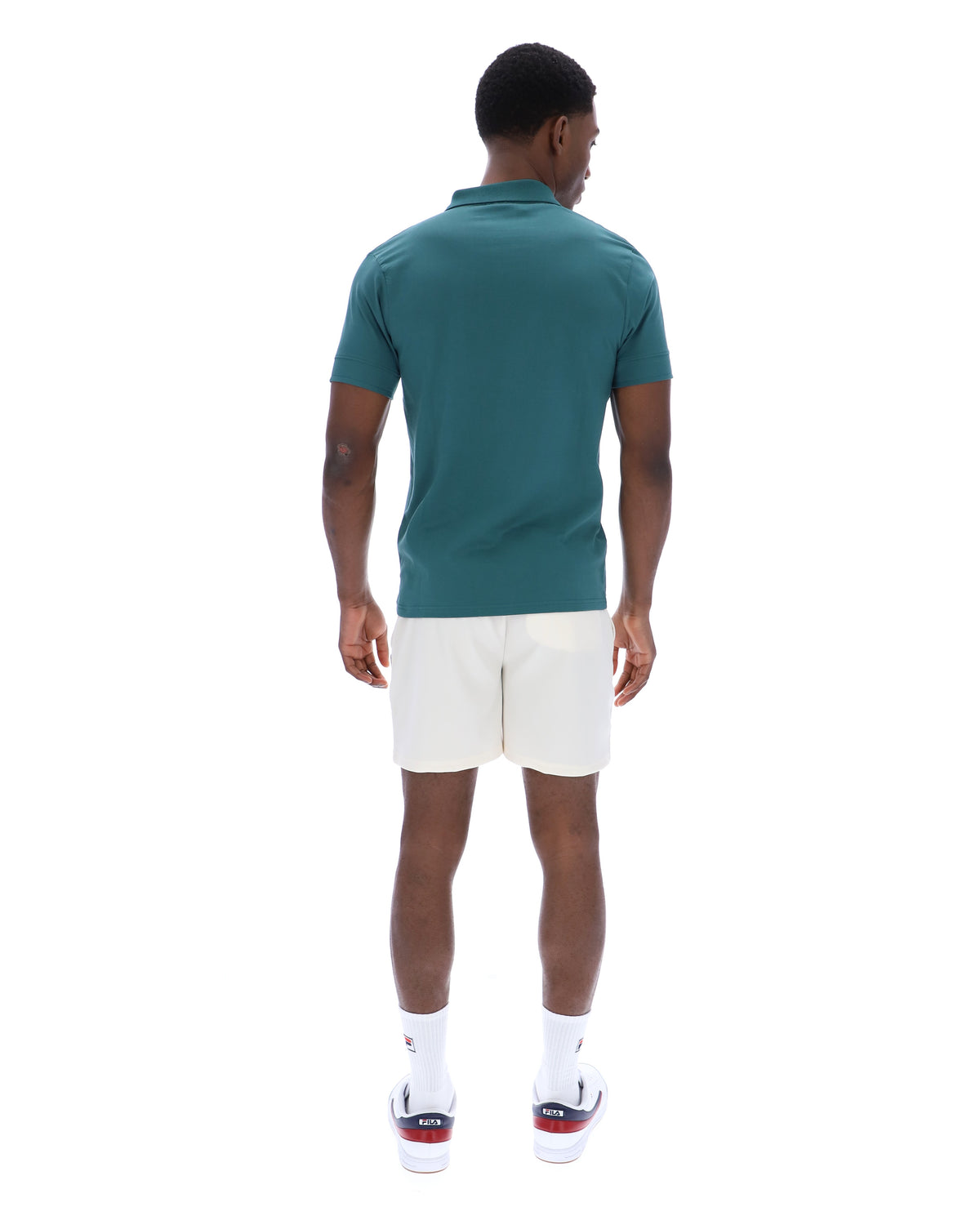 Displays a model wearing the Mediterranea 'FILA' branded Pierro Zip Up Polo