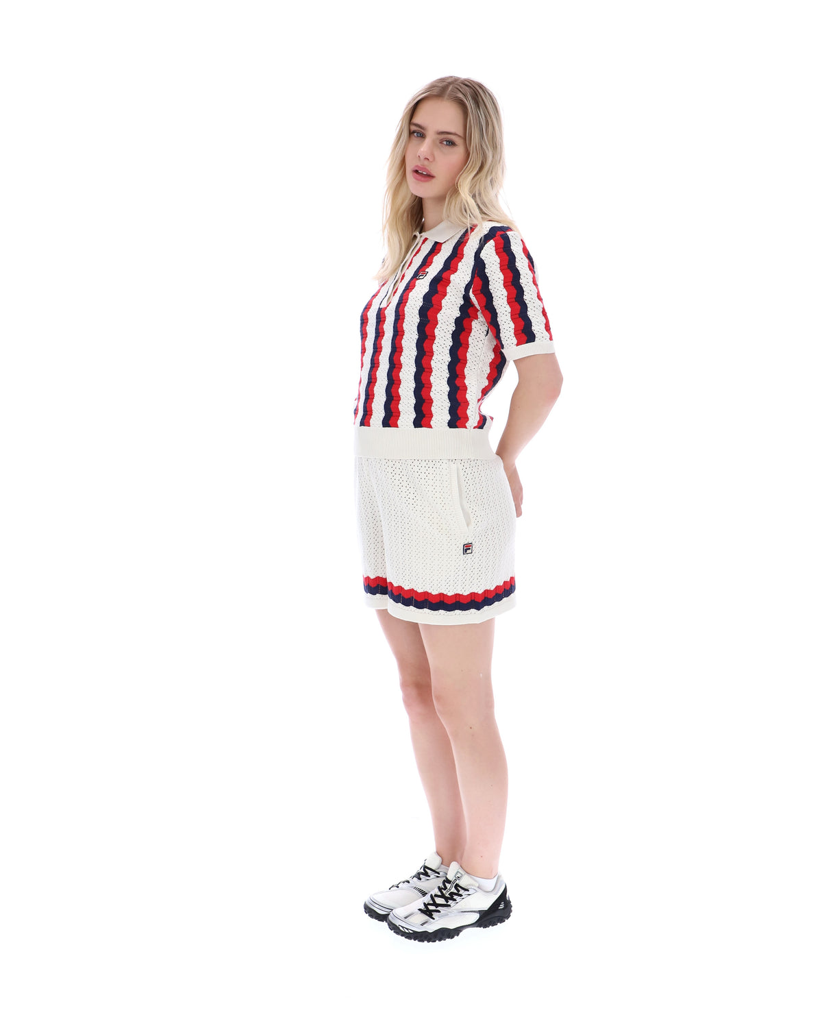 Displays a model wearing the Porto 'Fila' branded Knitted Crochet Stripe Polo