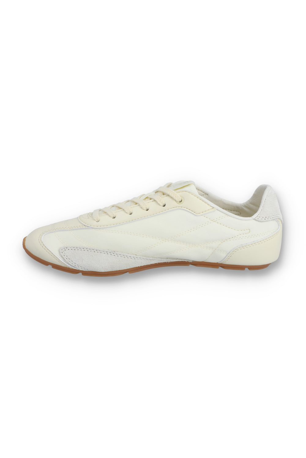 Medial profile view of a FILA Ritmo trainer in off-white nylon, showing the unbranded inner side panel with tonal curved stitching, light grey suede overlays, cream laces, and a slim brown rubber sole against a white background.