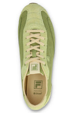 Overhead view of a FILA Ritmo trainer in green suede, showing the flat cream laces, tongue branding, and a branded cream OrthoLite insole against a white background.