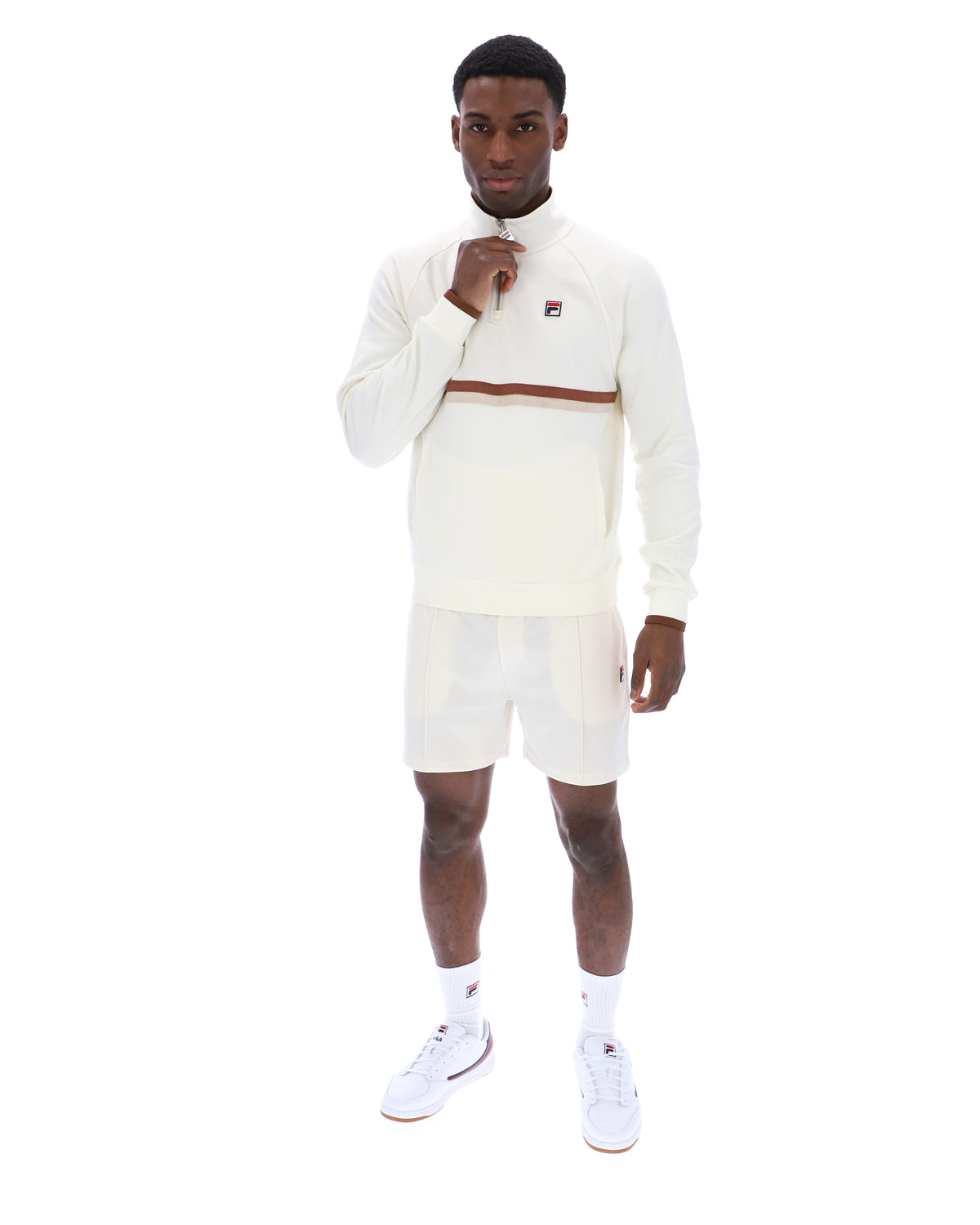 Displays a model wearing the Gardenia 'FILA' branded Rolando 1/4 Zip Neck Sweatshirt