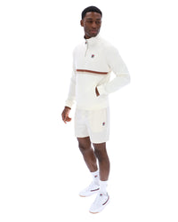 Displays a model wearing the Gardenia 'FILA' branded Rolando 1/4 Zip Neck Sweatshirt