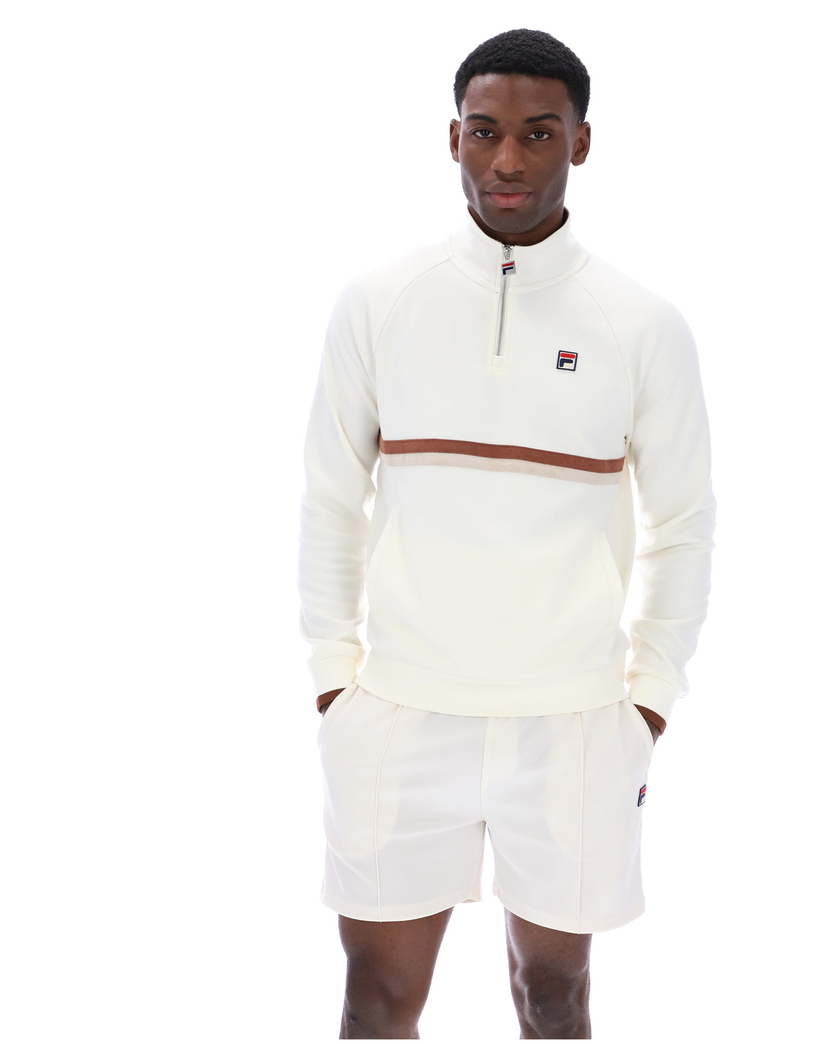 Displays a model wearing the Gardenia 'FILA' branded Rolando 1/4 Zip Neck Sweatshirt