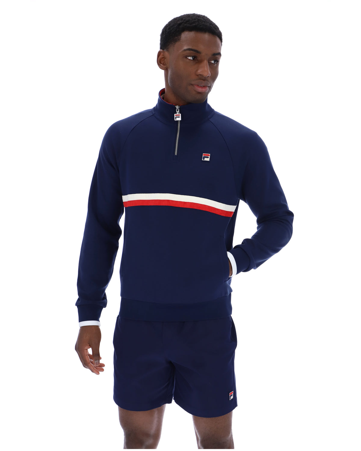 Displays a model wearing the Navy 'Fila' branded Rolando 1/4 Zip Neck Sweatshirt