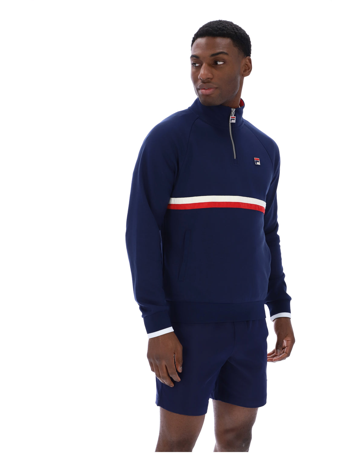 Displays a model wearing the Navy 'Fila' branded Rolando 1/4 Zip Neck Sweatshirt