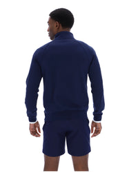 Displays a model wearing the Navy 'Fila' branded Rolando 1/4 Zip Neck Sweatshirt