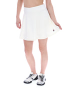 White tennis skirt worn by a person on a white background
