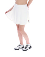 Person wearing a white tennis skirt with a brand logo on a white background