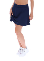 Navy blue skirt worn by a person on a white background