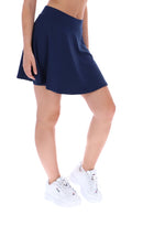 Navy blue skirt worn by a person on a white background