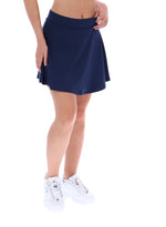 Navy blue skirt worn by a person on a white background