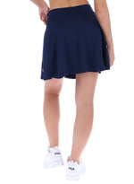 Navy blue skirt worn by a person on a white background