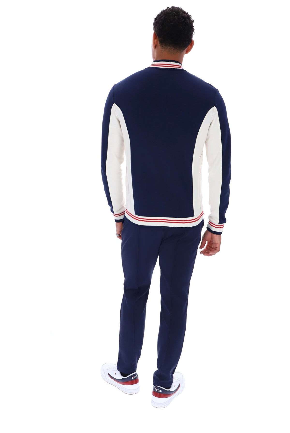 Displays a model wearing the Peacoat 'FILA' branded Settanta Baseball Track Top