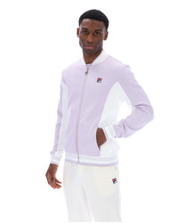 Displays a model wearing the Misty Lilac 'FILA' branded Settanta Baseball Track Top