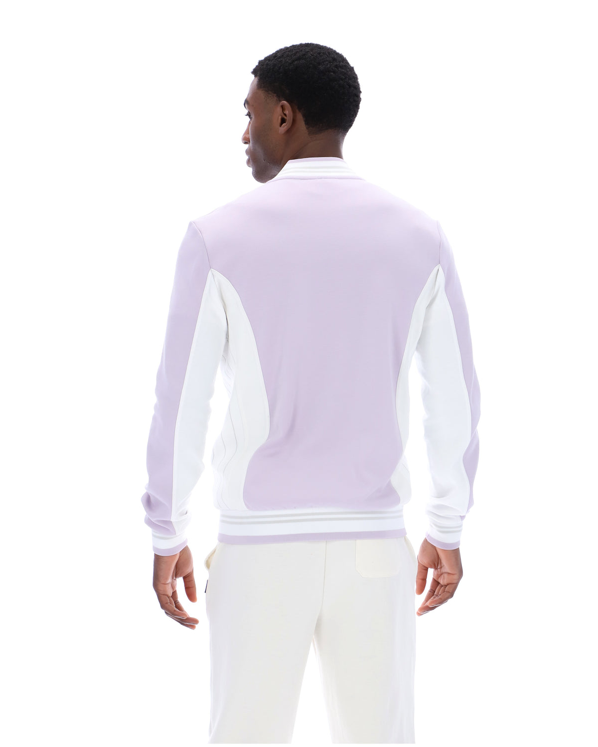 Displays a model wearing the Misty Lilac 'FILA' branded Settanta Baseball Track Top