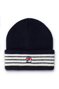 A navy blue knit beanie hat featuring a folded cuff with horizontal white and navy stripes and a small embroidered Fila logo in the center.