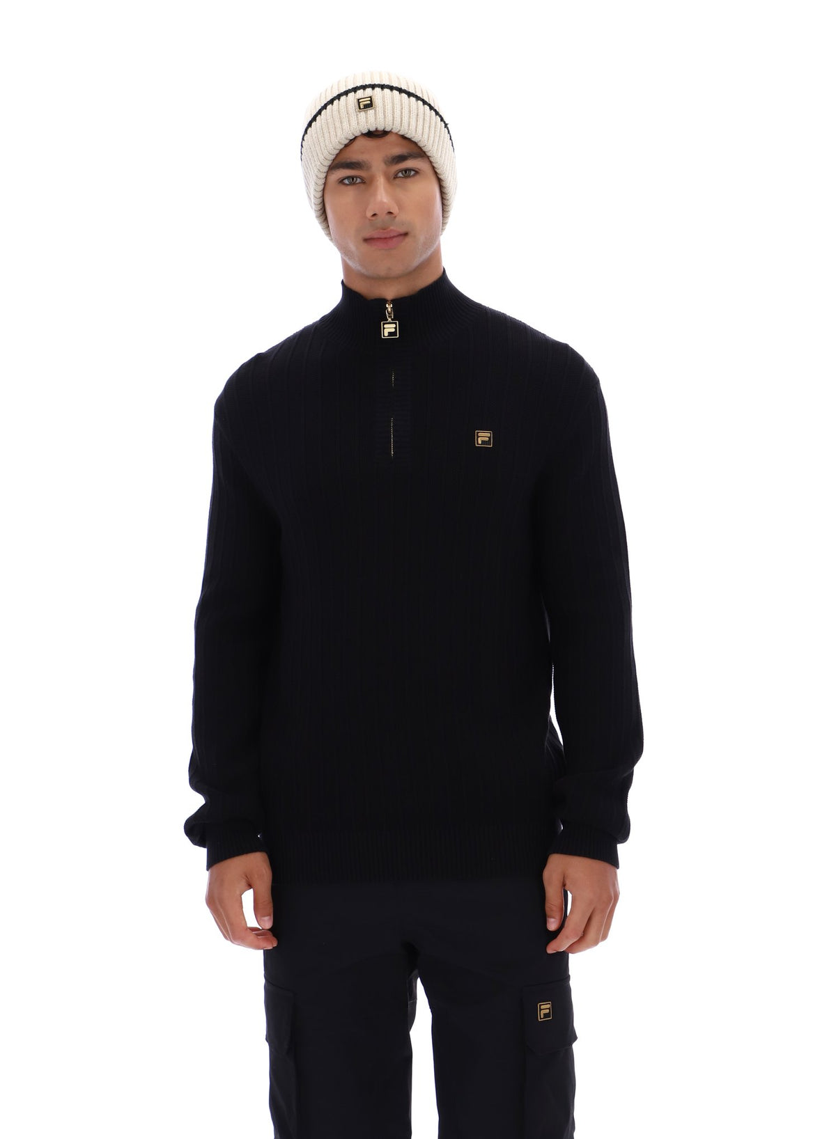 Displays a model wearing the Black 'FILA' branded Stevie 1/4 Zip Funnel Neck Textured Knit