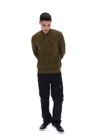 Displays a model wearing the Dark Olive Stevie 1/4 Zip Funnel Neck Textured Knit