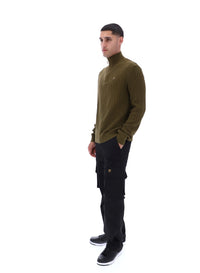 Displays a model wearing the Dark Olive Stevie 1/4 Zip Funnel Neck Textured Knit