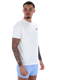 Man wearing a white t-shirt and light blue shorts on a white background