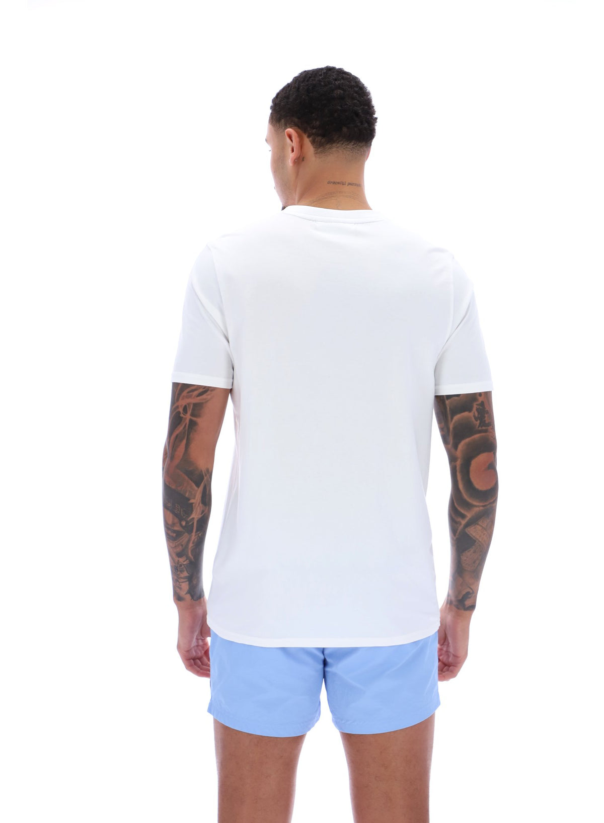 Man wearing a white t-shirt and light blue shorts on a white background