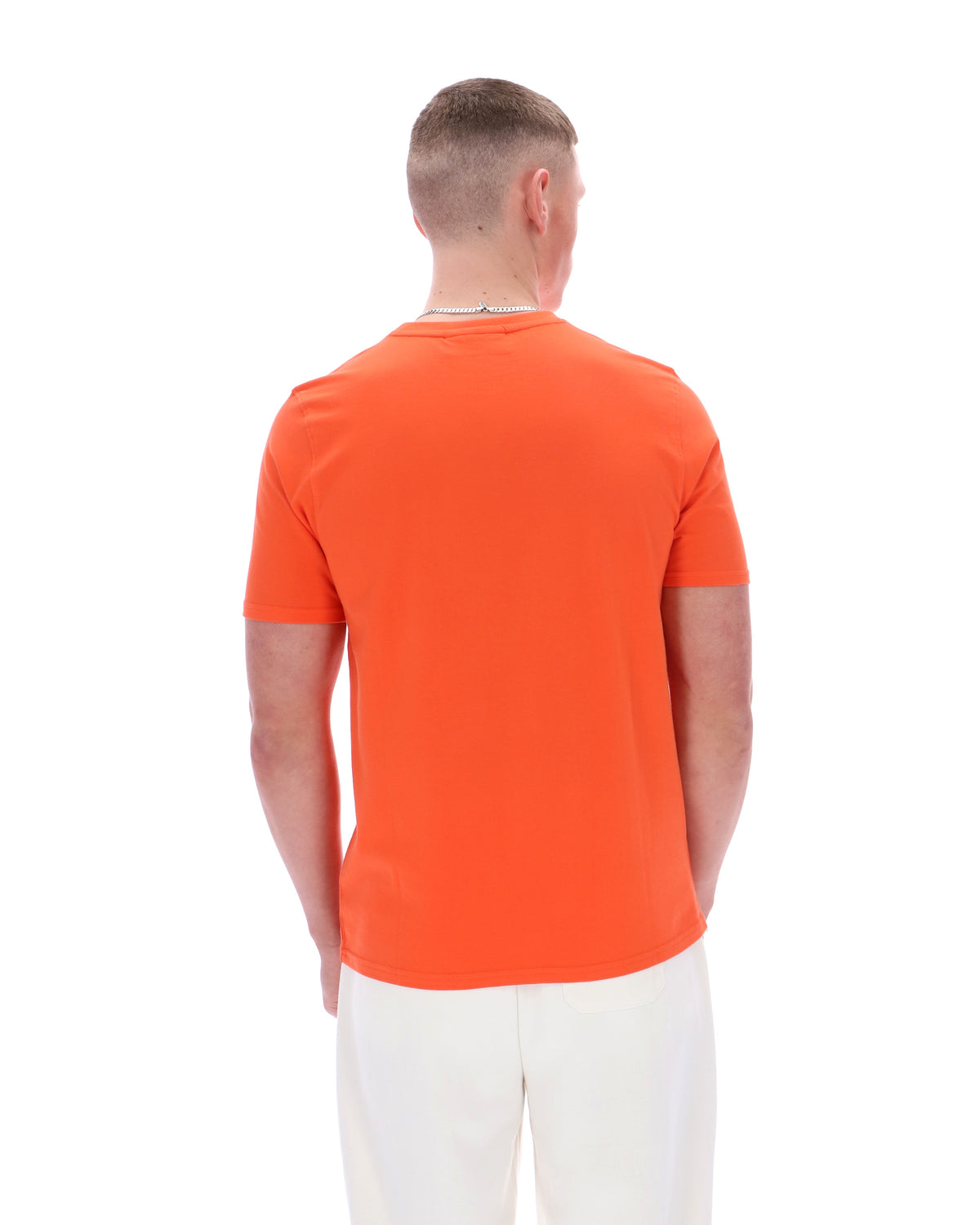 Man wearing an orange t-shirt on a white background