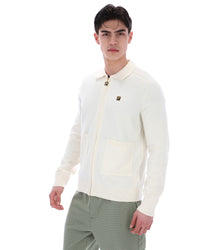 Displays a model wearing the Coconut Milk 'FILA' branded Teddy Knitted Shirt