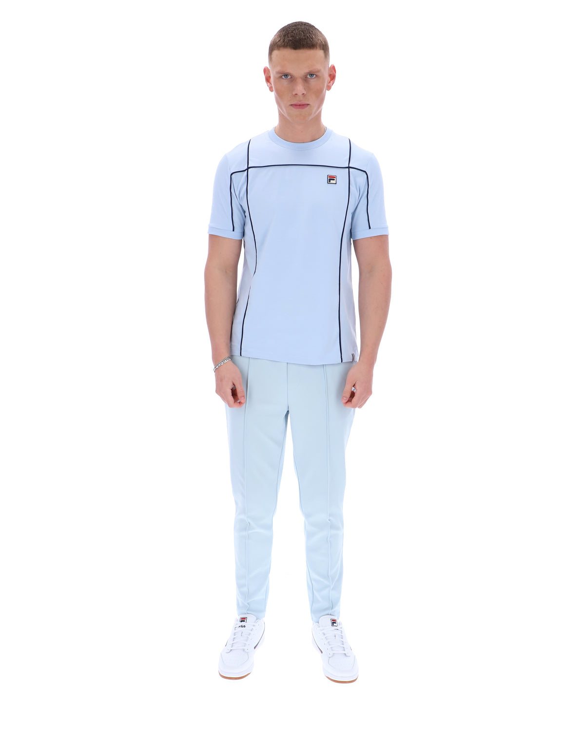 Displays a model wearing the Skyway 'FILA' branded Terri T-Shirt with Contrast Piping
