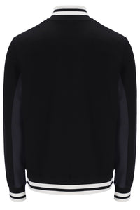 Black varsity jacket with white and black striped trim on a white background
